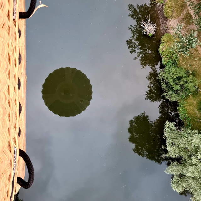  Reflection of the hot air balloon in the water 