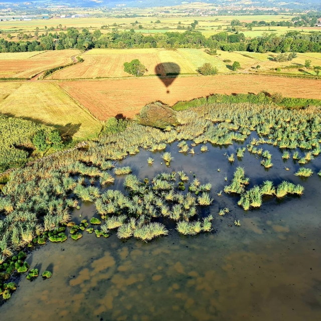  Shadow of the hot air balloon on magnificent landscapes 