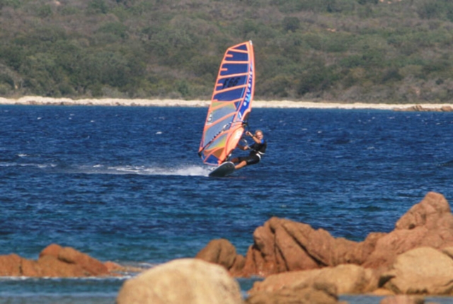  Man sliding on the water with a Wind Surf 