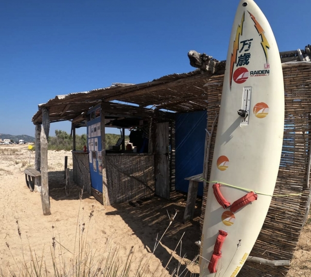  Cabin on the beach and surfboard