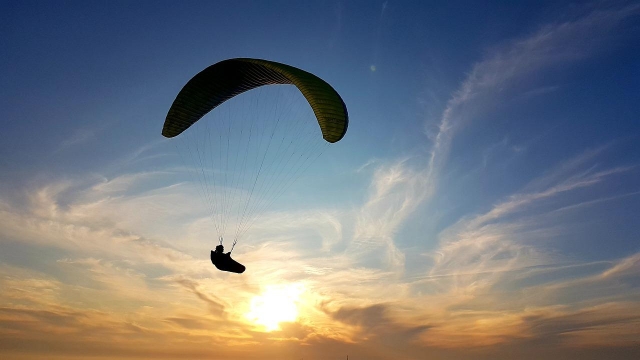  Paragliding at sunset sun 