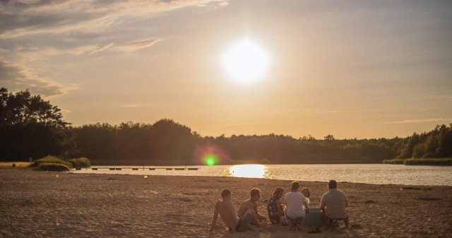  The beach of the pond at sunset 