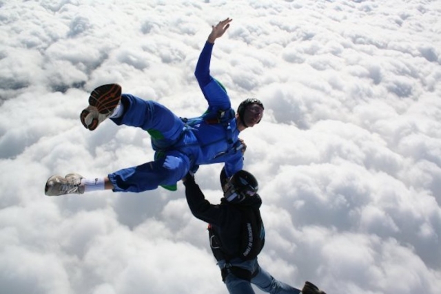  Parachute jump above the clouds 