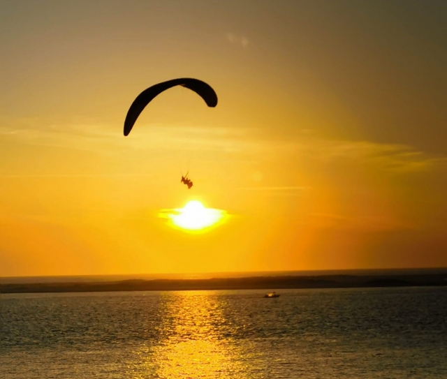 Paragliding over the bay of Arcachon at sunset 