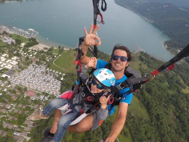  Child flight gliding over the blue lake 
