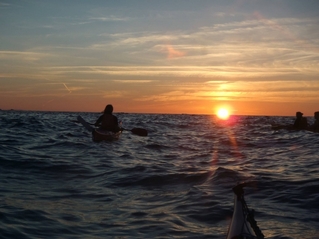  Kayak at sunset on the water 