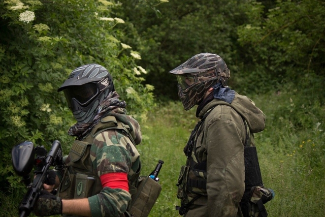  Paintball players in the forest 
