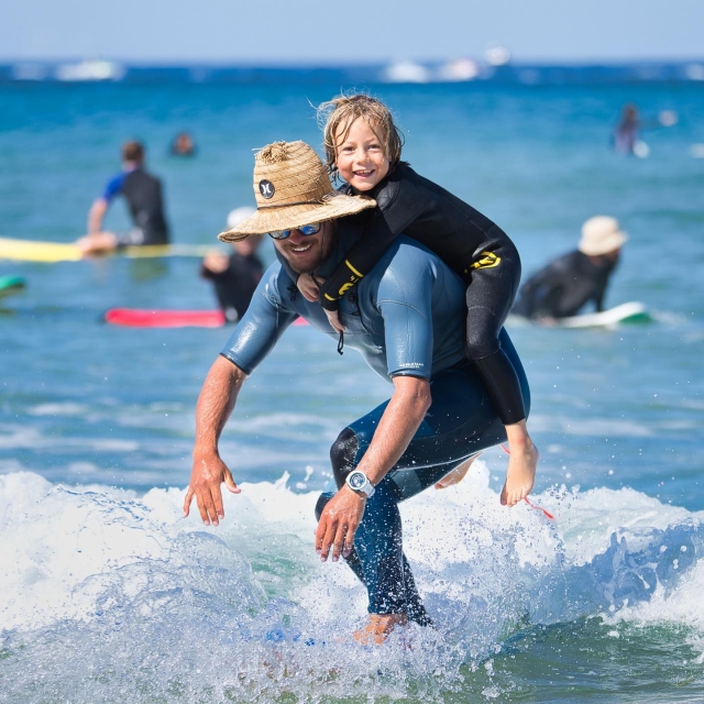  Surf instructor and child 