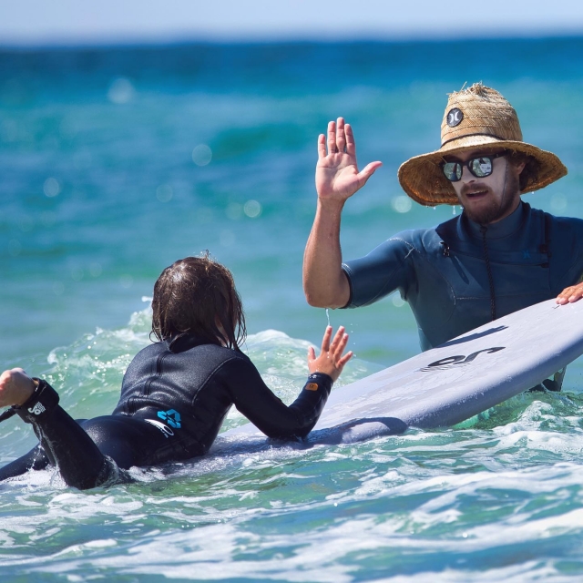  Surf instructor listening 