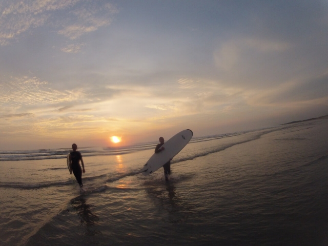  Surfing at sunset 