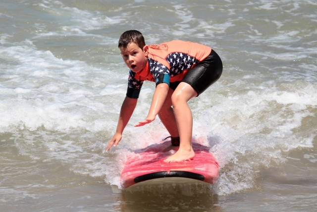  Child sliding on the wave 