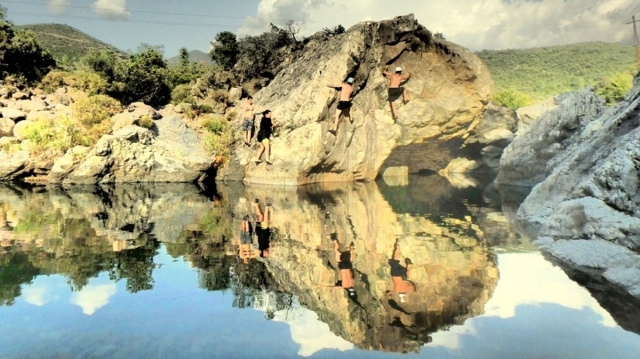  Reflection of rocks on the sea 