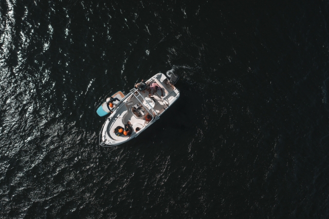 Boat on the open sea under the sun 