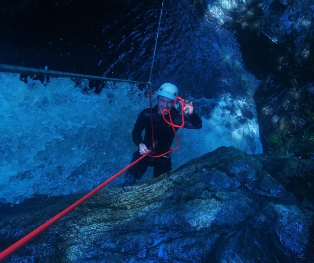 Canyoning through a rapid 