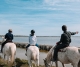 Horseback riding along the beach  Arles