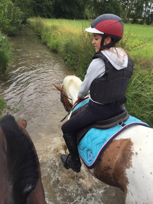  A rider crosses a stream 