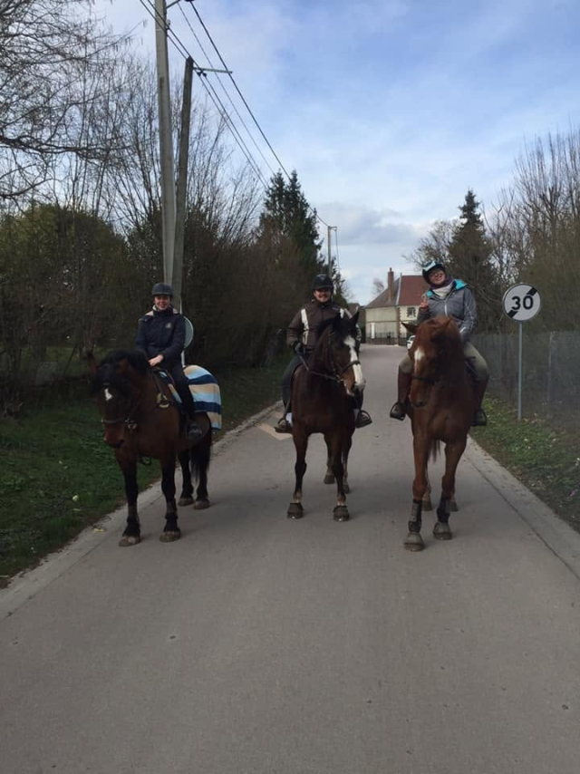  Three riders on a small road 